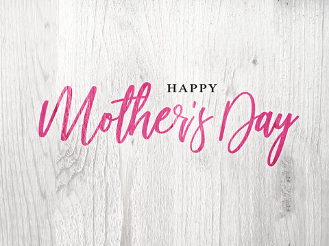 Happy Mother's Day Pink Calligraphy Text Over Rustic Whitewashed Wood Texture