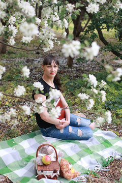 girl in a spring apple flower garden
