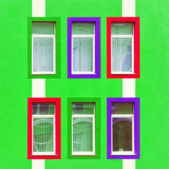 Green Wall With Colorful Windows