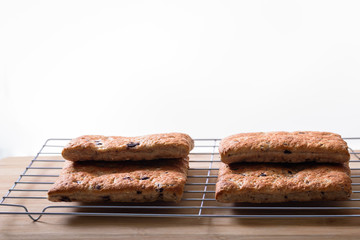 Flat bread on a grill with a white background, side view