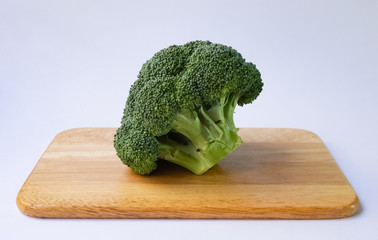 broccoli on wood plate