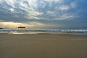 coast of china, at low tide the beach with sunset