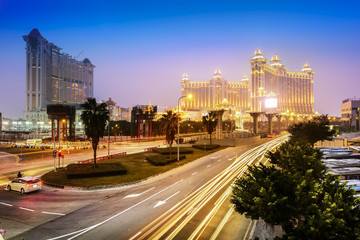 Cityscape of Macau at night. In the distance is Galaxy Macau. Located in Macau.