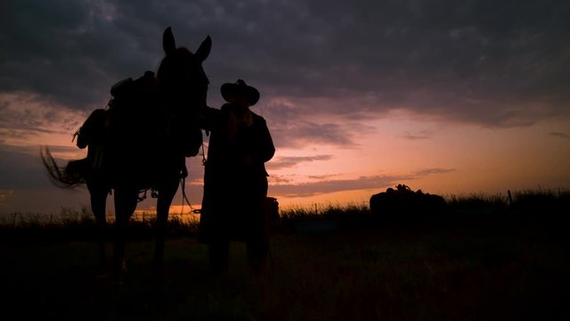 Cowboy and Horse Silhouette (Slow Motion)