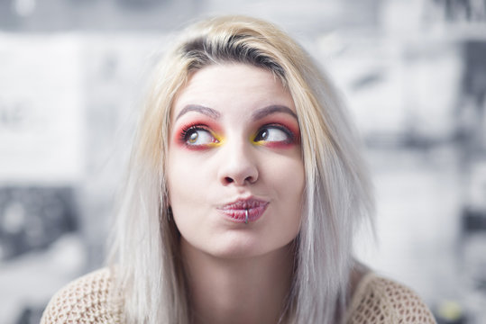 Blond young hipster woman posing