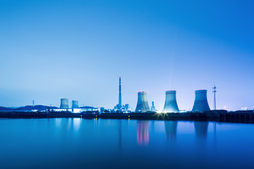 power plant near water at twilight