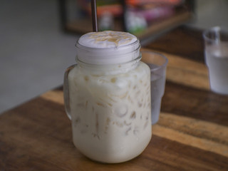 Iced coffee on wooden table.
