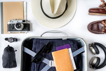 Top view of travel accessories and suitcase  on white table, Travel planning concept on white table, Travel planning concept