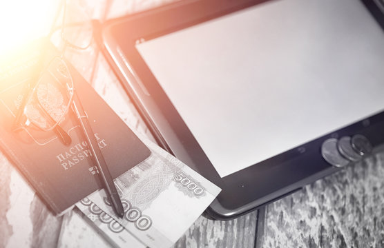 The graph of income growth. Electronic tablet with a graph of gr - Powered by Adobe