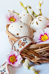 Czech traditional easter decoration, my own homemade laced white eggs in the nest with flowers and ribbon