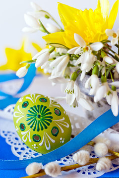 Traditional Czech easter decoration - flowerpot with white snowdrop flowers and my own homemade decorated white perforated eggs.