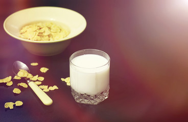 Corn flakes in a plate. Breakfast from flakes with honey and mil