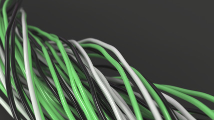 Twisted black, white and green cables and wires on black surface