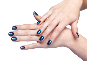 Obraz na płótnie Canvas Female hands with blue and shiny nails manicure isolated on white