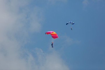 Fototapeta na wymiar parachute./Under the clouds.