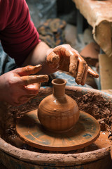 Potter at work. Workshop place.