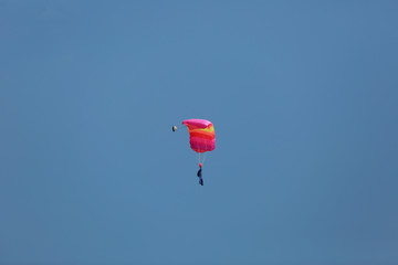 parachute./Under the clouds.
