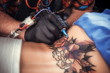 Professional tattooist forms a tattoo tattoo parlor