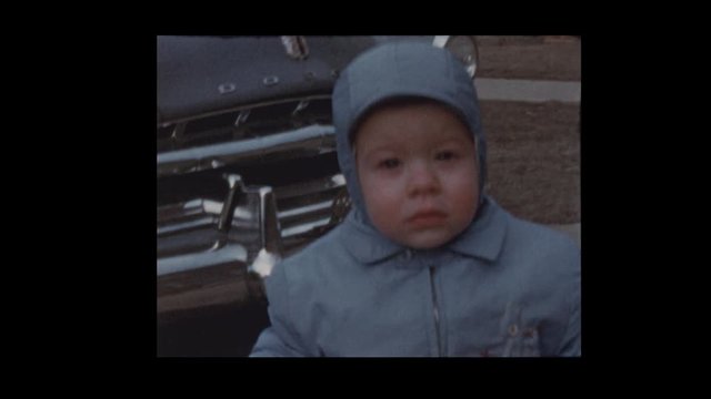 1953 toddler boy bundled up