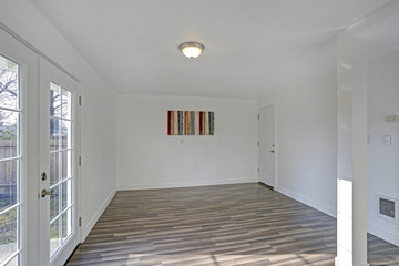 Empty dining room. Pure white walls make the room spacious