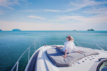beautiful woman enjoying luxurious yacht cruise, sea travel by luxury boat - obrazy, fototapety, plakaty