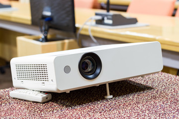 projector on the table in a meeting room For presentations, Business Concept.