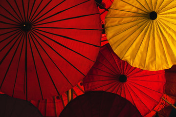 red and yellow colorful traditional asian umbrellas, color background