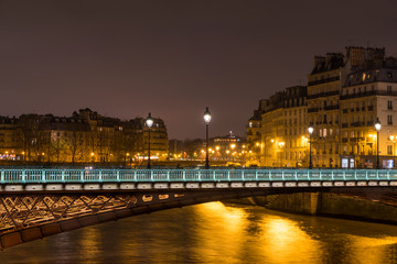 Fototapeta na wymiar River Seine with Pont des Arts and Institut de France at night in Paris