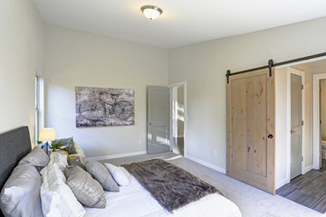 Cozy bedroom interior with vaulted ceiling