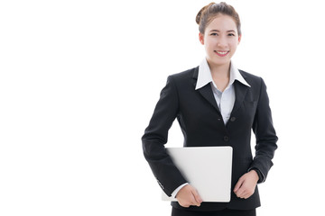 Business concept : Smiling young Asian businesswoman in black suit and white t-shirt holding laptop isolated on white background