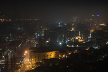 Fototapeta na wymiar Misty dawning in Sarajevo, view from the Yellow Fortress