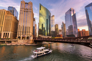 Chicago Downtown skyline and speedboat on Chicago river at sunset, Chicago, Illinois.  © lucky-photo
