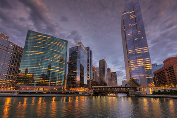 Chicago city skyline and Chicago river at dusk, Chicago, Illinois.