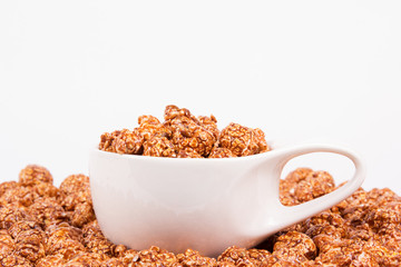 Chocolate caramel popcorn and coffee cup. Coffee and popcorn