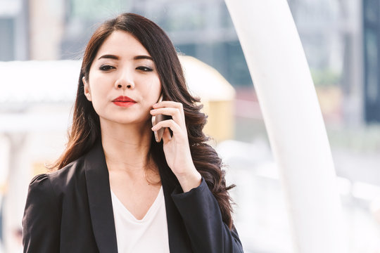 Portrait of businesswoman using smartphone