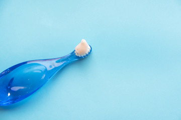 Fototapeta na wymiar children's dental equipment isolated on blue background