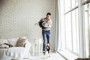 loving father plays with his baby daughter