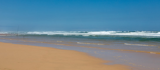 Fototapeta na wymiar Fishing rods on a beach in South Africa