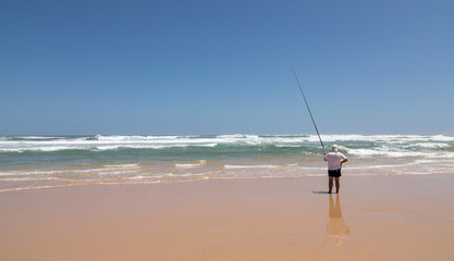 Angler on a South African beach