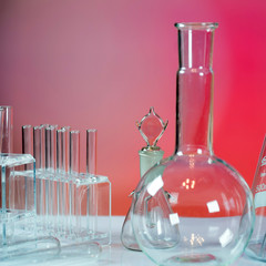 Microscope with lab glassware, science laboratory research concept