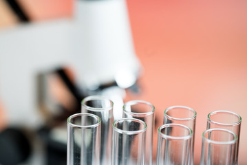 Microscope with lab glassware, science laboratory research concept