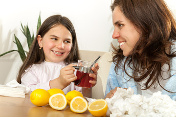 Mother and daughter with cold or flu