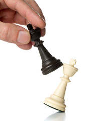 King chess figure in front of row of pawn chess figures