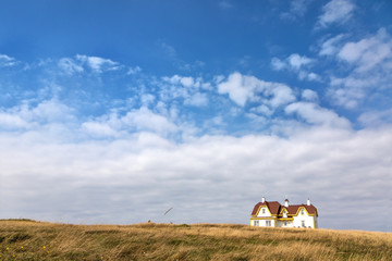 Painted house on the horizon, Cap Aux Meules