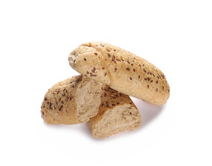 Whole wheat bread roll slices with sesame and linseed isolated on white background