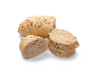 Whole wheat bread roll slices with sesame and linseed isolated on white background