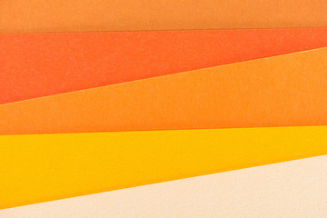 close-up shot of orange shades paper layers for background