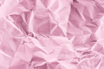 Fototapeta premium close-up shot of crumpled pink paper for background