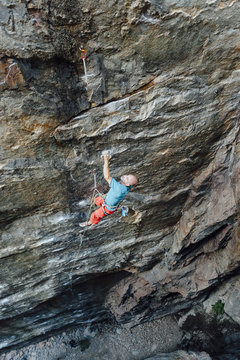 Man rock climbing on steepest granite route