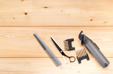 items for short hair cutting, on a wooden background